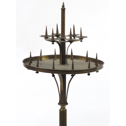 16 - 19th century brass Gothic style floor standing candelabra, approximately 133cm high