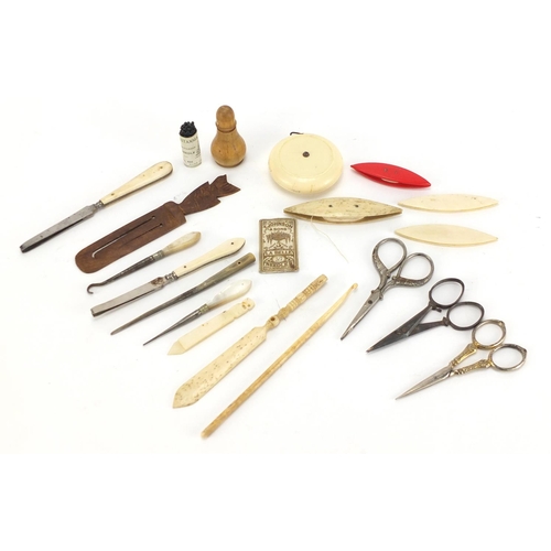 384 - Sewing objects including Dean Bakelite tape measure, bone cotton winders and Mother of Pearl handled... 