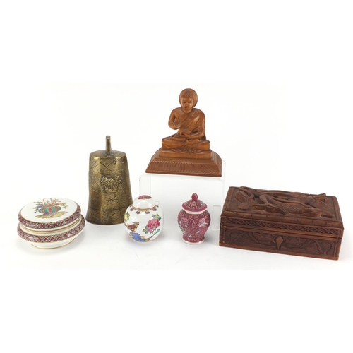 382 - Objects including a Chinese jewellery box carved with a dragon, brass cow bell and jars and covers