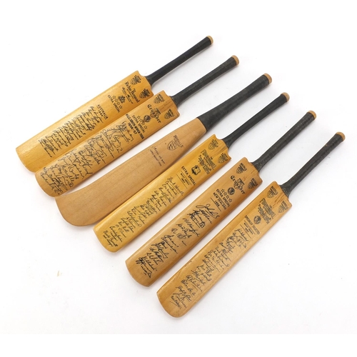 385 - Six miniature cricket bats with facsimile signatures