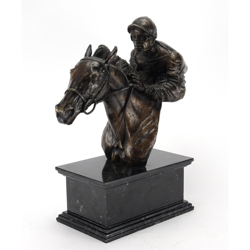 2031 - Patinated bronze bust of a jockey on horseback, raised on a rectangular black marble base, incised G... 
