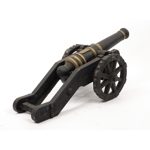 2011 - Hand painted cast iron model cannon with stand, 75cm in length