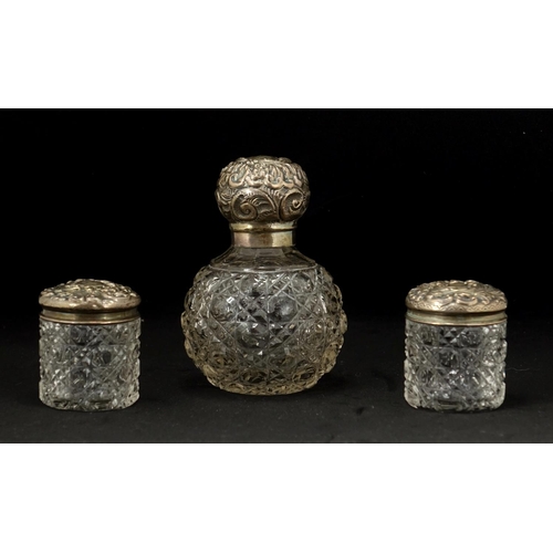 2246 - Victorian cut glass scent bottle with silver lid and two jars, London hallmarks, the largest 9cm hig... 