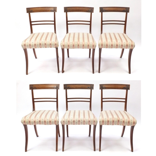 37 - Set of six Regency mahogany dining chairs, with carved top rails and striped upholstered stuff over ... 