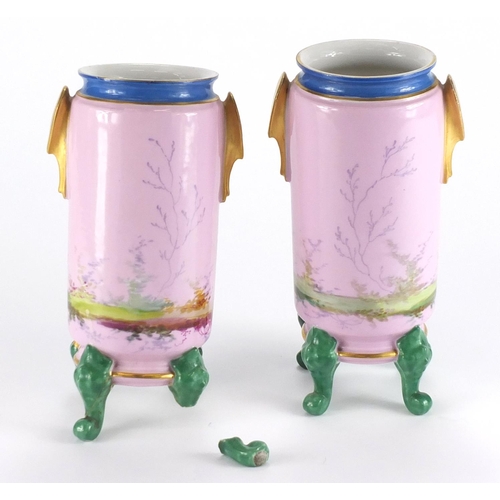 390 - Pair of continental porcelain twin handled vases, hand painted with young females, 21.5cm high