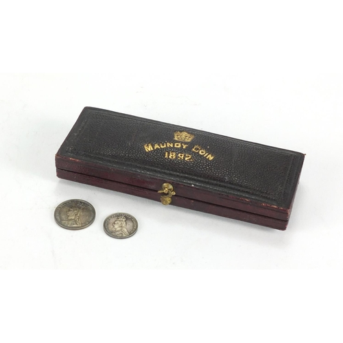 2226 - Maundy 1892 tooled leather coin case, housing two Maundy coins