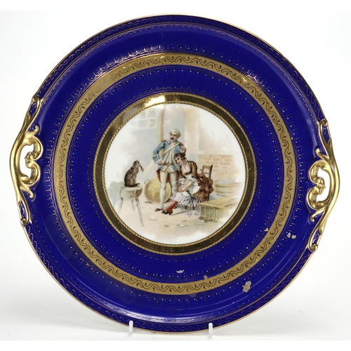 2127 - Vienna style porcelain tray with twin handles, decorated with two figures and a cat, 33cm in diamete... 