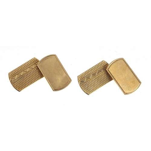 2375 - Pair of 9ct gold cufflinks with engine turned decoration, 1.1cm in length, approximate weight 3.2g