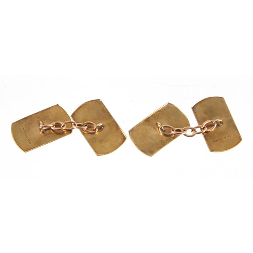 2375 - Pair of 9ct gold cufflinks with engine turned decoration, 1.1cm in length, approximate weight 3.2g