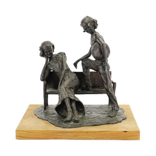 2206 - David Roper Curzon, patinated bronze study two figures by a bench, raised on a rectangular oak block... 