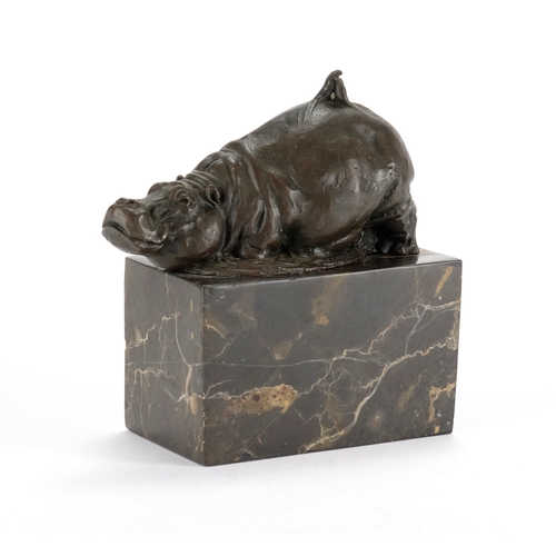 2116 - Patinated bronze hippo, raised on a rectangular marble block base, 17cm high