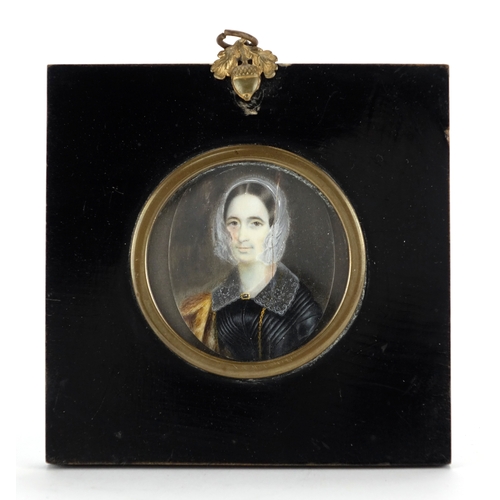 2227 - Oval Georgian hand painted portrait miniature of a female, housed in an ebonised easel frame, the mi... 