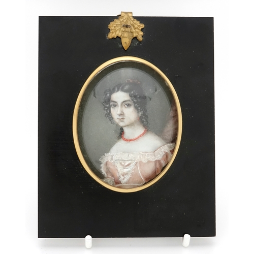 2228 - Oval hand painted portrait miniature of a female wearing a pink dress, framed, the miniature 7cm x 7... 