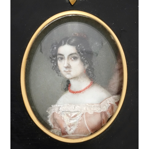 2228 - Oval hand painted portrait miniature of a female wearing a pink dress, framed, the miniature 7cm x 7... 