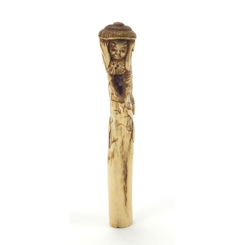 357 - Chinese bone parasol handle carved with two figures and trees, 16cm in length