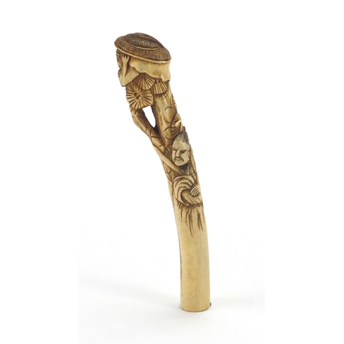 357 - Chinese bone parasol handle carved with two figures and trees, 16cm in length