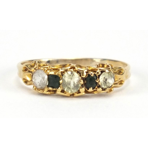 715 - Antique unmarked gold ring set with green and clear stones, size M, approximate weight 1.6g, housed ... 