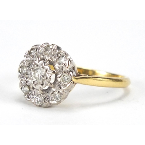 670 - 18ct gold and platinum diamond flower head ring, size O, approximate weight 3.8g