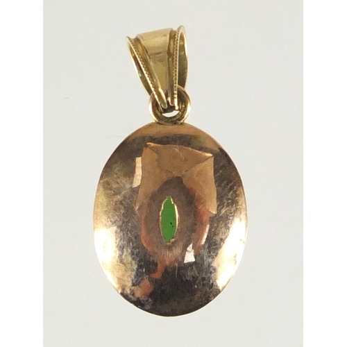 655 - Unmarked gold cabochon green jade pendant, matching earrings and one other, the pendant 2.1cm in len... 