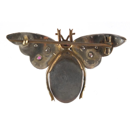 750 - Unmarked white metal multi gem bug brooch with opalescent body and diamond wings, 5cm wide, approxim... 