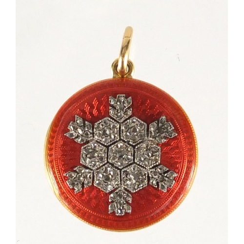 646 - Unmarked gold red guilloche enamelled locket with diamond snowflake decoration, 1.8cm in diameter, a... 
