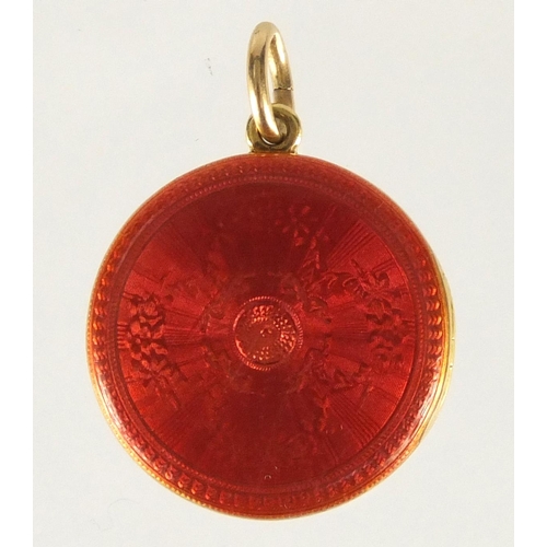 646 - Unmarked gold red guilloche enamelled locket with diamond snowflake decoration, 1.8cm in diameter, a... 