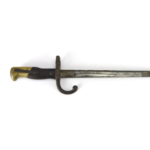 233 - French Military interest bayonet with scabbard, impressed marks to the blade, 66cm in length