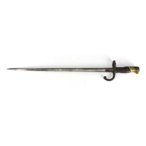 233 - French Military interest bayonet with scabbard, impressed marks to the blade, 66cm in length