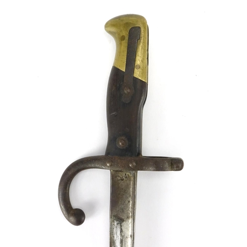 233 - French Military interest bayonet with scabbard, impressed marks to the blade, 66cm in length