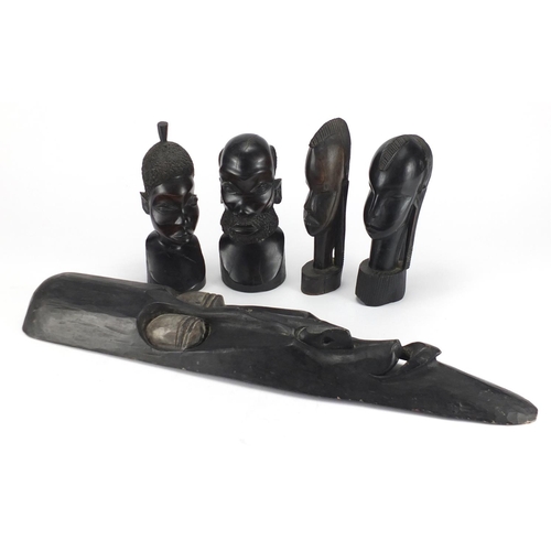 418 - Four African carved ebony busts and a wall mask, the largest 64cm in length