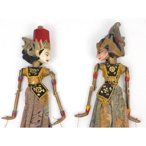 636 - Pair of Eastern hand painted carved wood puppets, 58cm high