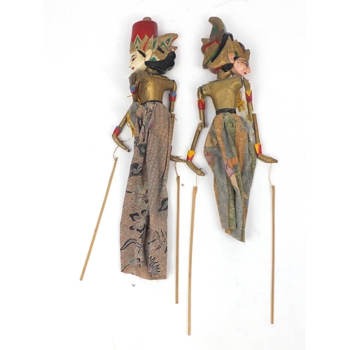 636 - Pair of Eastern hand painted carved wood puppets, 58cm high