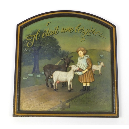 223 - Advertising wooden panel decorated with a young girl feeding goats, 56.5cm x 53cm
