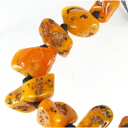 769 - Baltic amber coloured segment necklace, 62cm in length, approximate weight 121.0g