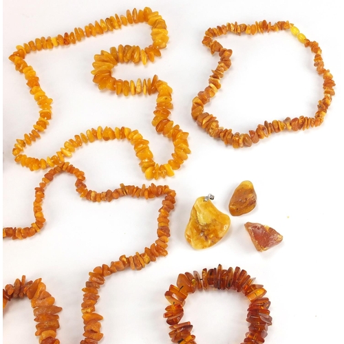 770 - Six baltic and natural amber coloured necklaces and bracelets, a pendant and two segments, approxima... 
