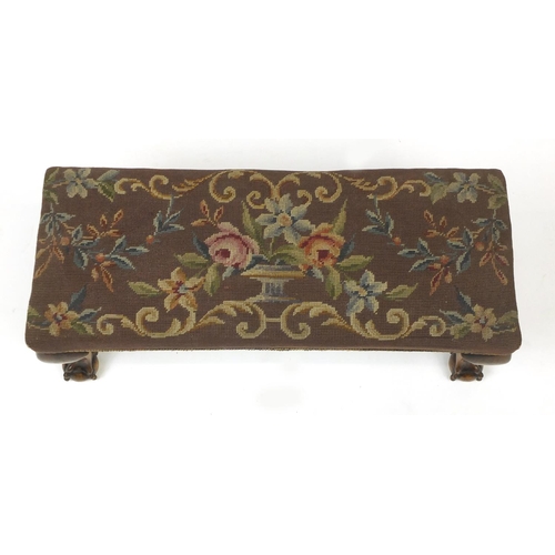 28 - Mahogany foot stool with ball and claw feet and needlepoint upholstery, 30cm H x 71cm W x 27cm D