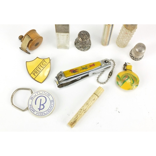 459 - Objects including glass scent bottles, bone needle case, treen sewing tape measure and silver thimbl... 