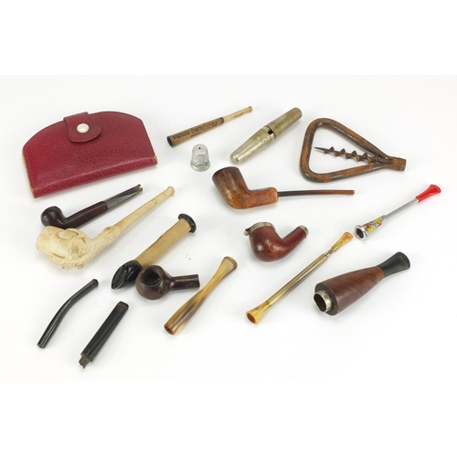 431 - Objects including vintage smoking pipes, cheroots and an antique steel corkscrew