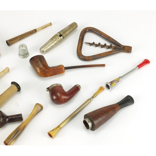 431 - Objects including vintage smoking pipes, cheroots and an antique steel corkscrew