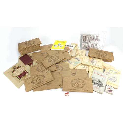 675 - Extensive collection of cigarette cards and tea cards, mostly arranged in albums
