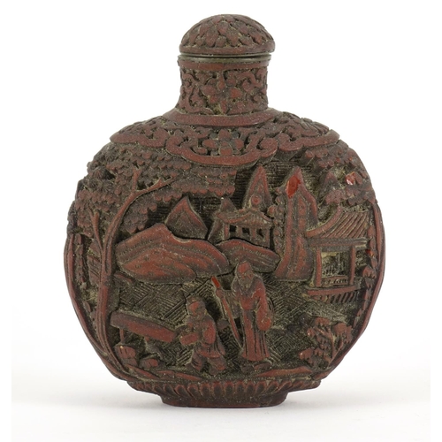 345 - Chinese cinnabar lacquer snuff bottle, carved with figures in a landscape, 8.5cm high