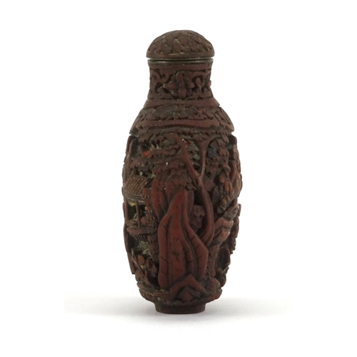 345 - Chinese cinnabar lacquer snuff bottle, carved with figures in a landscape, 8.5cm high