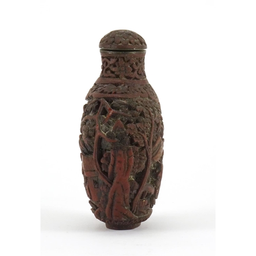 345 - Chinese cinnabar lacquer snuff bottle, carved with figures in a landscape, 8.5cm high