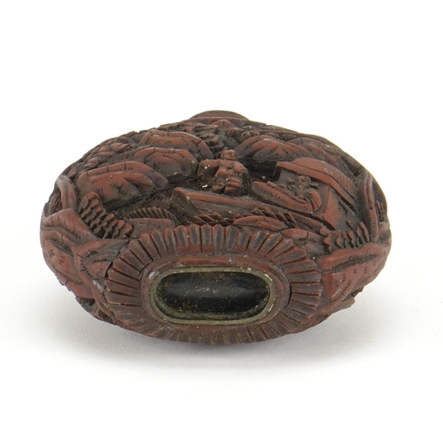 345 - Chinese cinnabar lacquer snuff bottle, carved with figures in a landscape, 8.5cm high