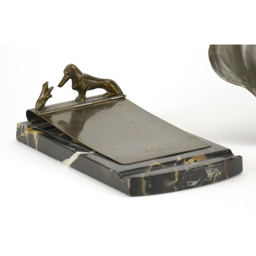 554 - Art Nouveau WMF pewter tray embossed with lovers and a WMF dog design letter clip raised on a marble... 