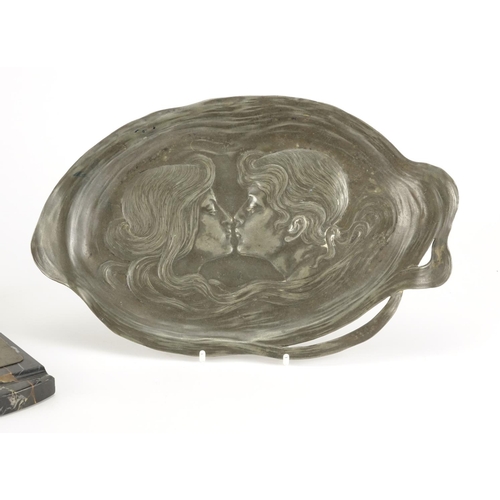 554 - Art Nouveau WMF pewter tray embossed with lovers and a WMF dog design letter clip raised on a marble... 