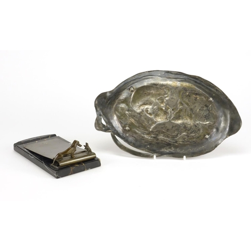 554 - Art Nouveau WMF pewter tray embossed with lovers and a WMF dog design letter clip raised on a marble... 