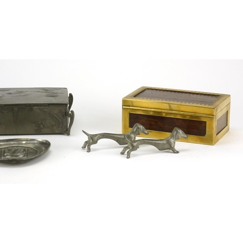 555 - Art Nouveau pewter and a WMF brass mounted box, the pewter including a casket embossed with a female... 