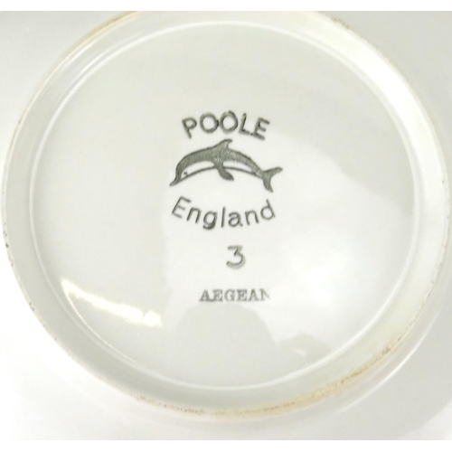 2419 - Two Poole Aegean shallow dishes and a plate, together with a Carter tile, the largest 31cm wide