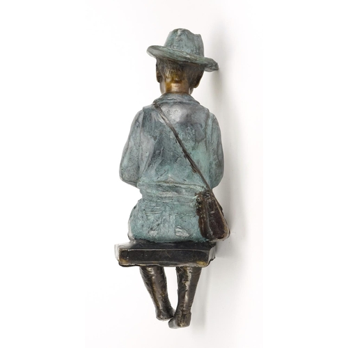 2119 - Bronze figure of a seated boy playing a flute, 32cm high